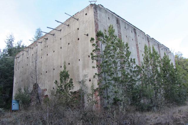 An image of one of a number of large concrete the nuclear facilities built on the island of Huemul.