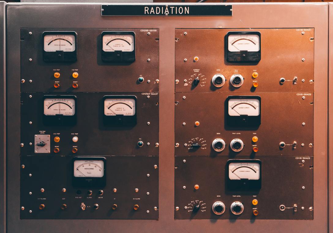 An old style control panel showing radiation at the top with numerous dials below